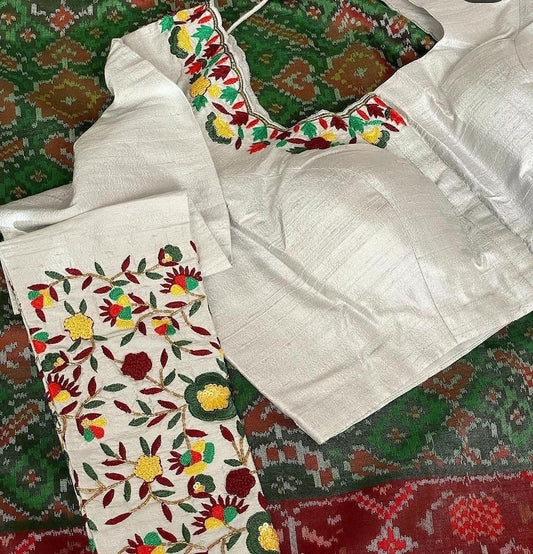 White linen blouse with traditional dark grey - red pattern