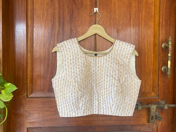 Cream sleeveless hand embroidery blouse