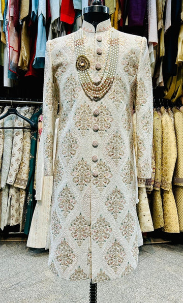 Ivory hand embroidered pink and pista touch men sherwani