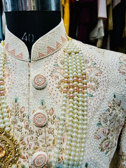 Ivory hand embroidered pink and pista touch men sherwani