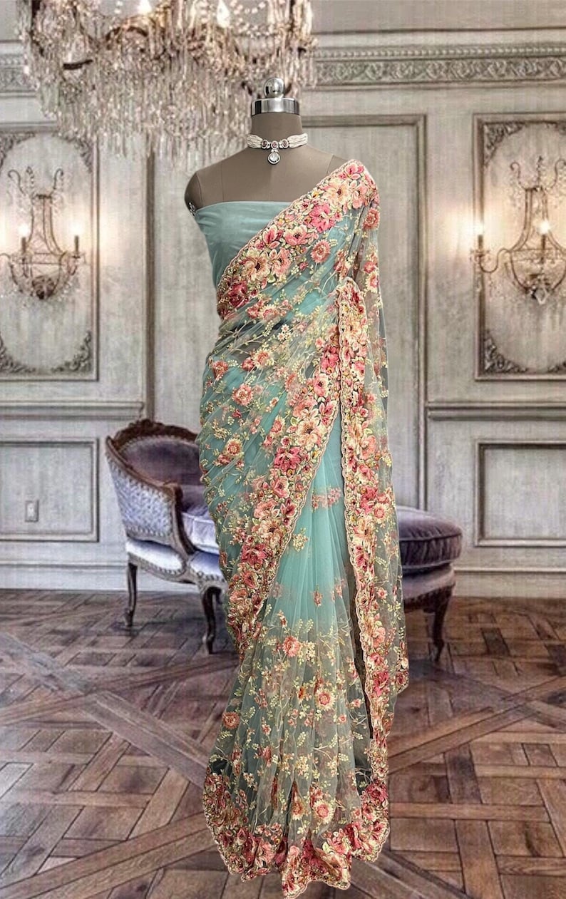 Beautiful cyan blue color net saree with multi color floral embroidery