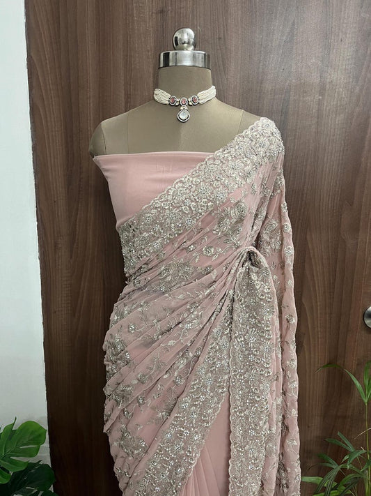 Beautiful peach- pink net saree