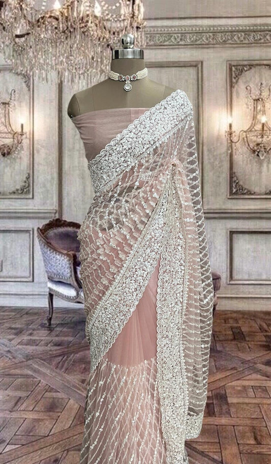 Beautiful peach colored net saree