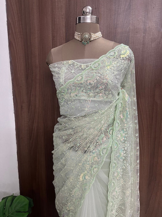 Beautiful pastel green net saree with pearls