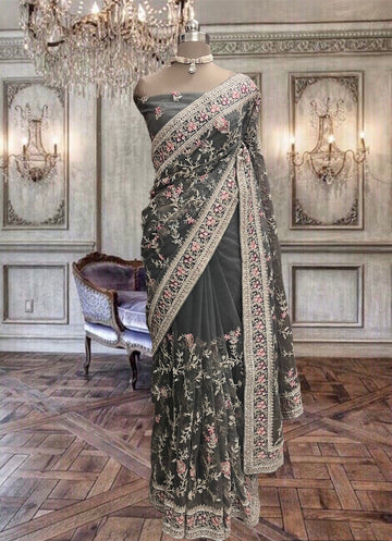 Beautiful dark grey net saree with stones and colorful threads