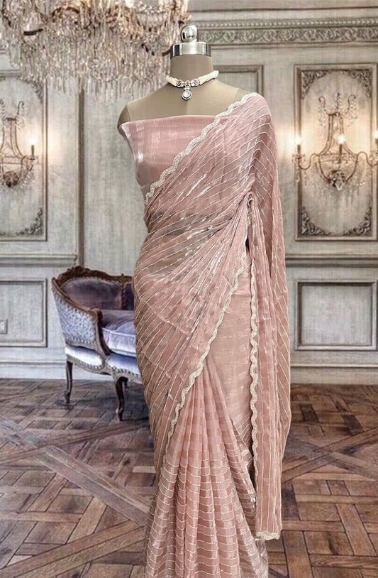 Beautiful nude peach organza saree with pipe embroidery