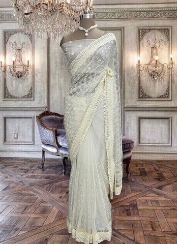 Beautiful cream color net saree with sequin work
