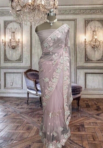 Beautiful pastel pink net saree with thread and stone work
