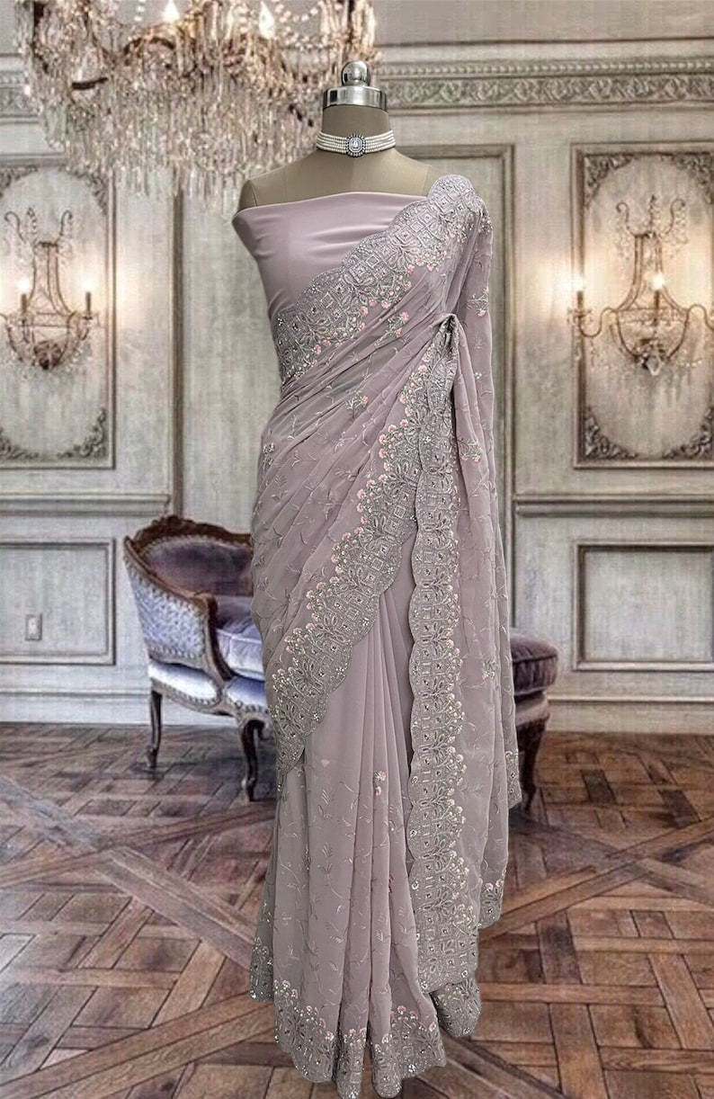 Beautiful lilac shimmer net saree with glitter work