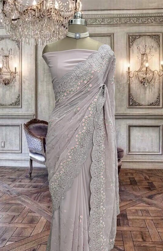 Beautiful lilac shimmer net saree with glitter work