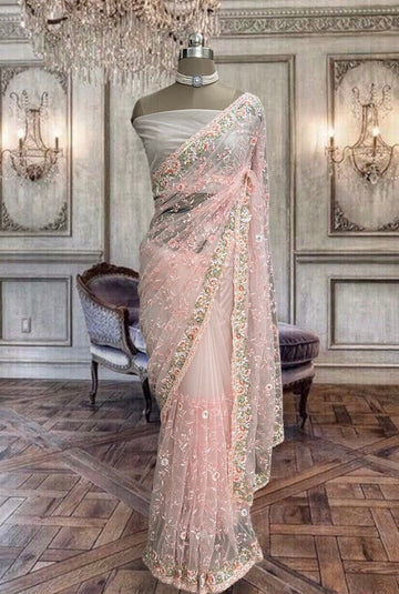 Beautiful peachish pink net saree with thread
