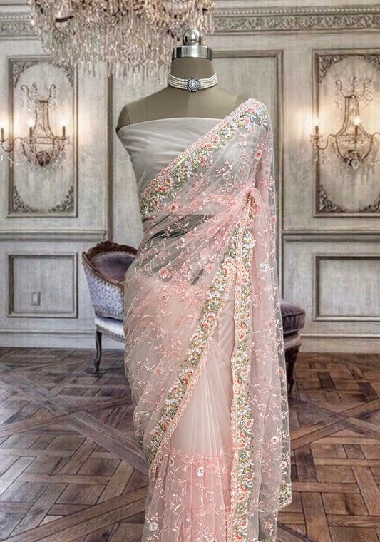 Beautiful peachish pink net saree with thread