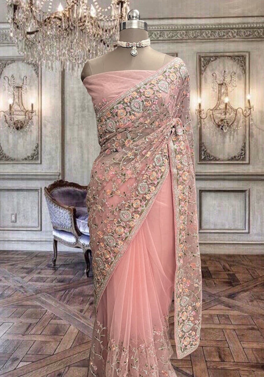 Beautiful peach- pink net saree with colourful thread work